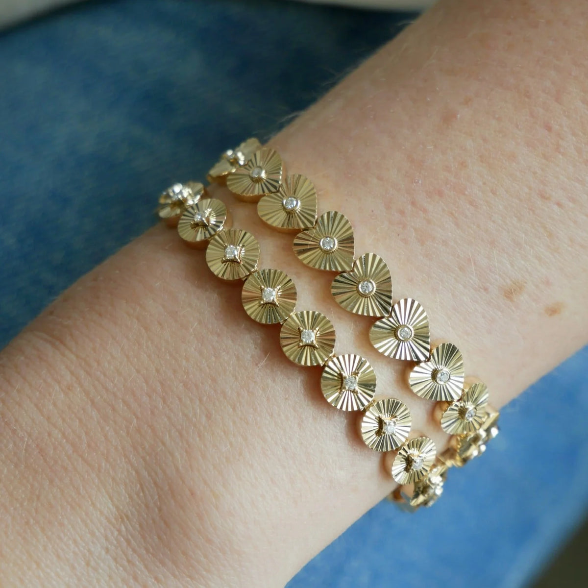 EF Collection Gold & Diamond Fluted Heart Eternity Bracelet in yellow gold with the gold diamond fluted circle eternity bracelet on models wrist. 
