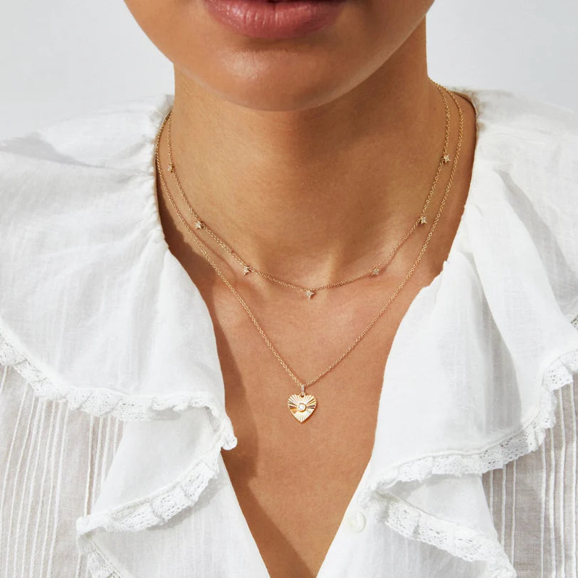 EF Collection Gold & Diamond Fluted Heart Necklace in yellow gold styled on models neck with diamond drop necklace. 