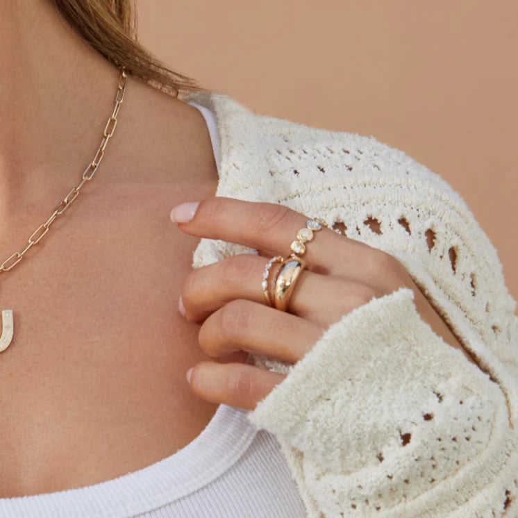 EF Collection Gold Frame Diamond Ring in yellow gold styled on model’s finger. 