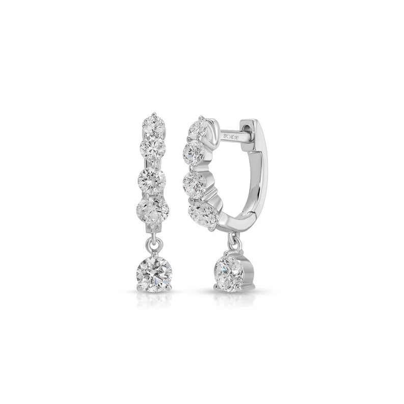 EF Collection Graduated Diamond Drop Mini Huggie Earrings in white gold on white background. 