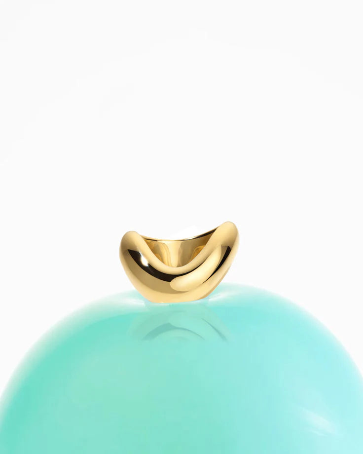 Rosario Navia Helium Large Ring in yellow gold on white background on top of light green balloon 