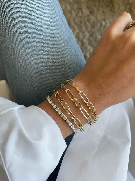 EF Collection Jumbo Lola Chain Necklace & Triple Wrap Bracelet in yellow gold on models wrist. 