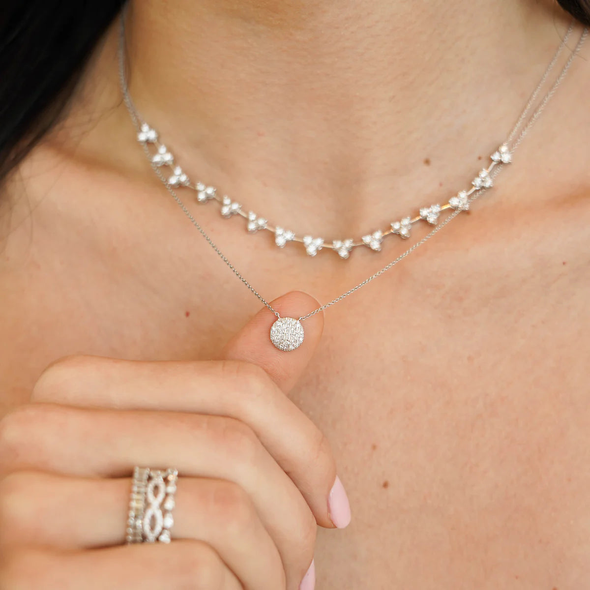 close up model holding Dana Rebecca Designs Lauren Joy Medium Disc Necklace in white Gold