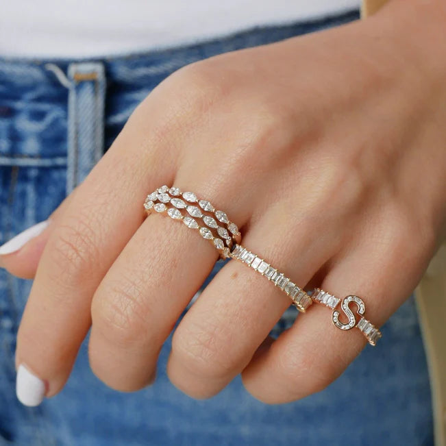 Three EF Collection Marquise Diamond Ring in stacked together on model’s hand. 