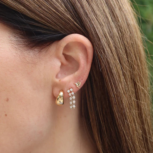 EF Collection Mini Hummingbird Stud Earring in yellow gold styled on models ear. 