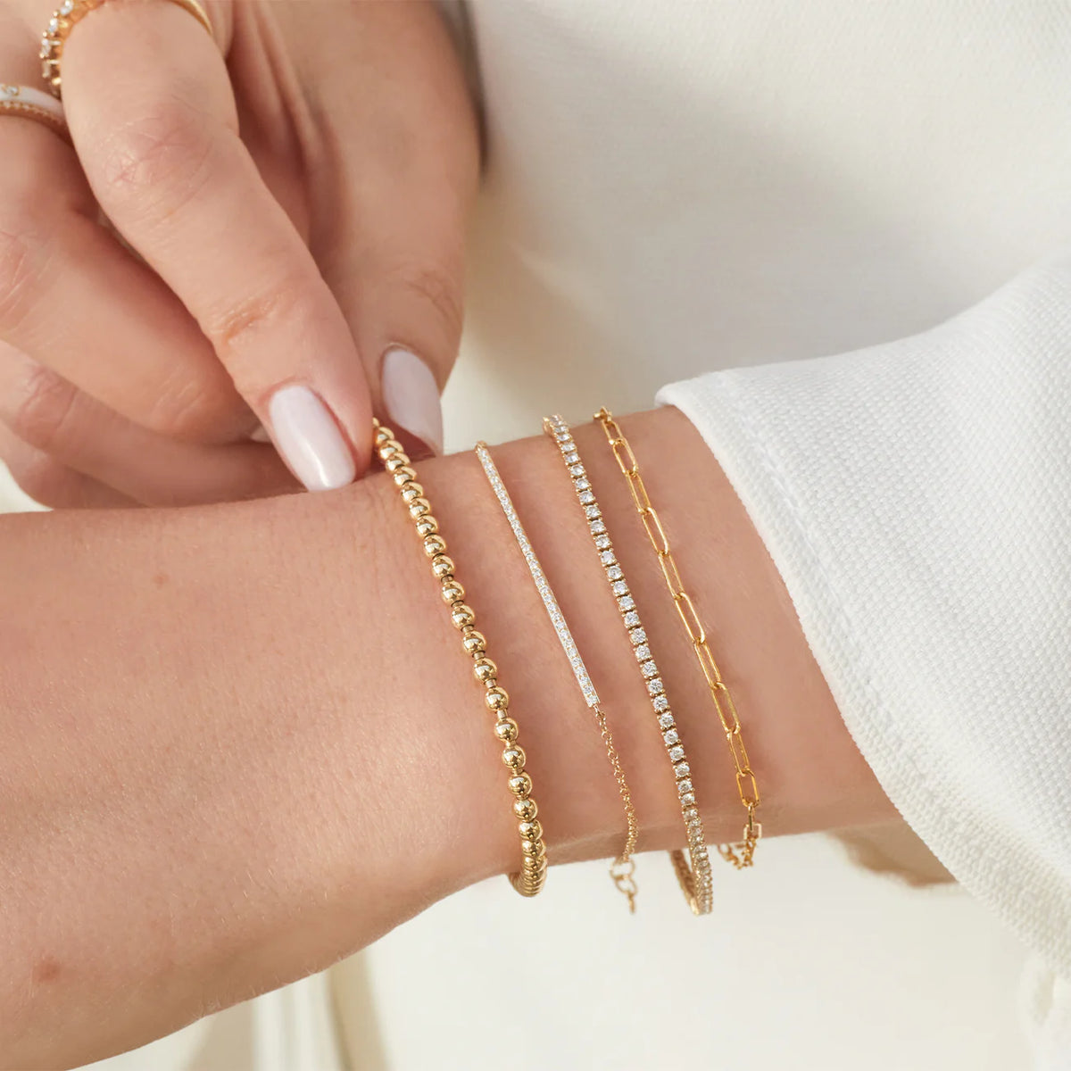 EF-Collection Mini Link Chain Bracelet in yellow gold on models wrist