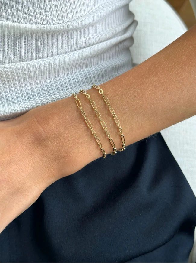 EF Collection Mini Mixed Chain Necklace And Triple Wrap Bracelet on models wrist. 