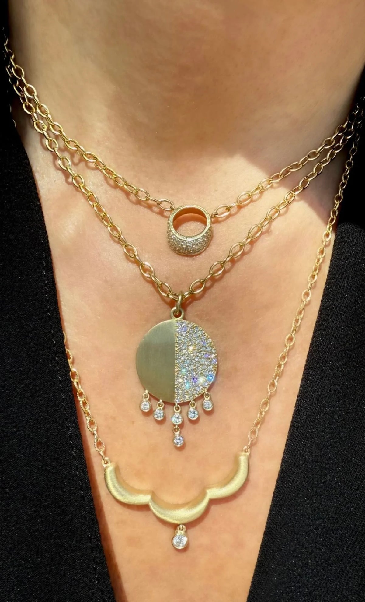close up of Onirikka Mixed Caviar Medallion in satin 14k yellow gold with pavé diamonds, modern gold pendant from the Avanti Collection.