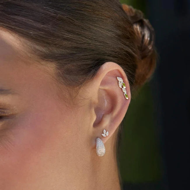 EF Collection Pavé Diamond Jumbo Dome Huggie Earrings styled on models ear. 