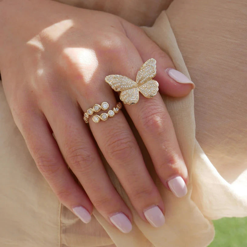EF Collection Pavé Diamond Jumbo Butterfly Ring in yellow gold on model’s finger.