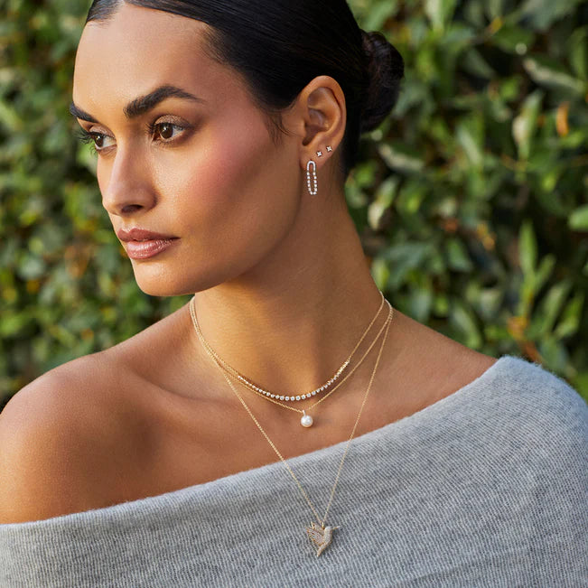 EF Collection Pearl Ball Drop Necklace in yellow gold layered on models neck