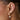 Close up of EF Collection Pearl Drop Gold Jumbo Dome Huggie Earrings on models ear. 