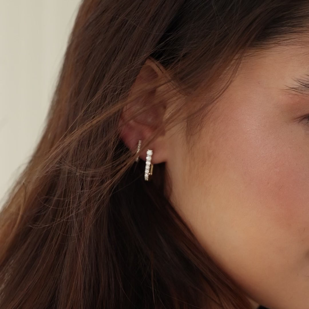 Video of Dana Rebecca Designs Ava Bea Graduating U Hoops in yellow gold styled on models ear 