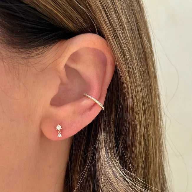Single EF Collection Prong Set Diamond Dangle Stud Earring in yellow gold on styled on models ear. 