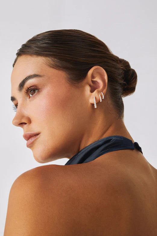 EF Collection Prong Set Diamond Maeve Hoop Earrings in white gold styled on models ear. 