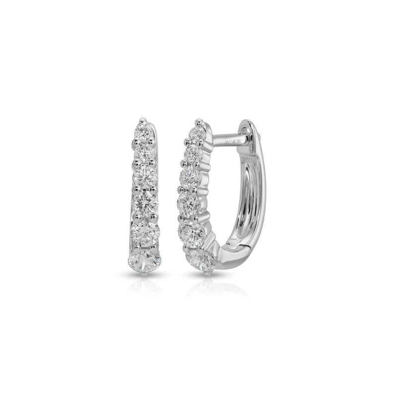 EF Collection Prong Set Diamond Mini Maeve Huggie Earrings in white gold on white background. 