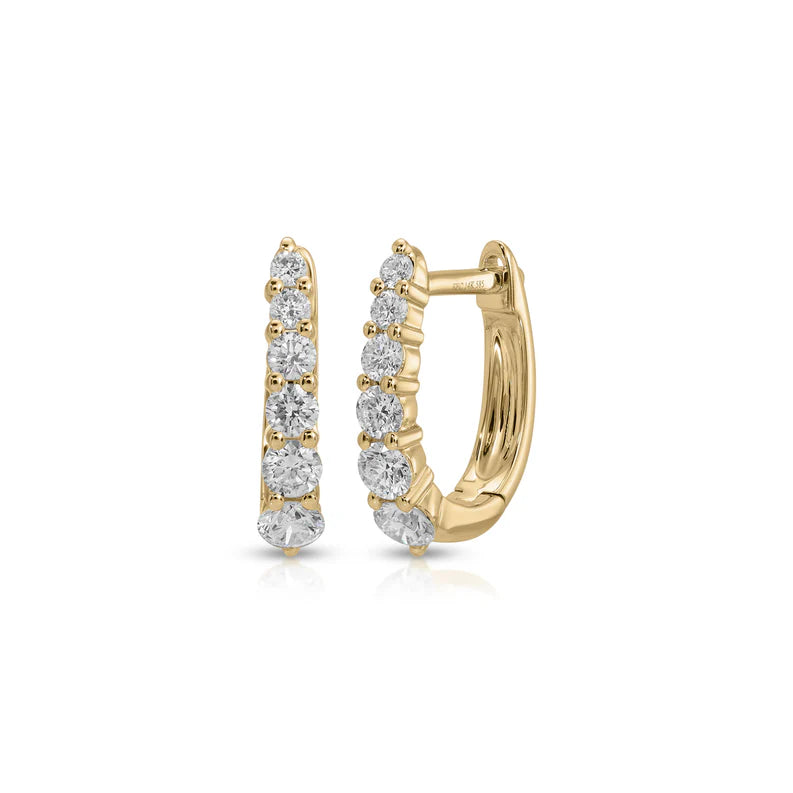 EF Collection Prong Set Diamond Mini Maeve Huggie Earrings in yellow gold on white background. 