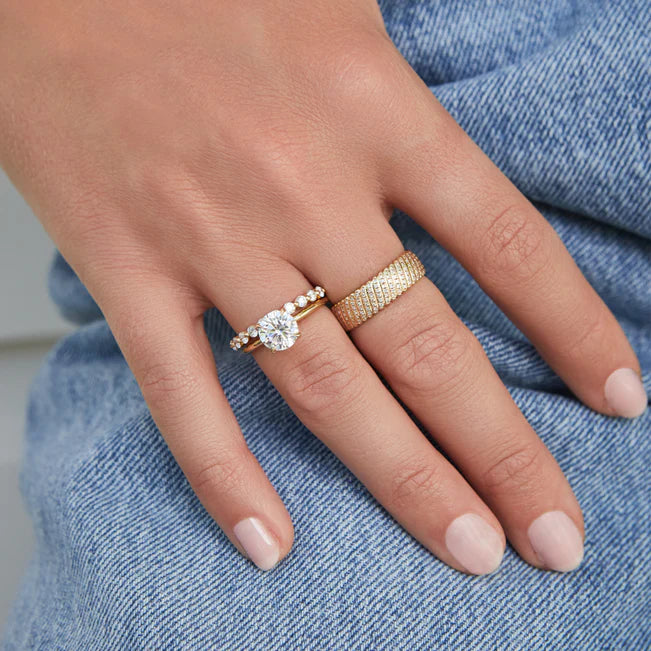 EF Collection Prong Set Diamond Ring in yellow gold stacked with diamond ring on model’s finger. 