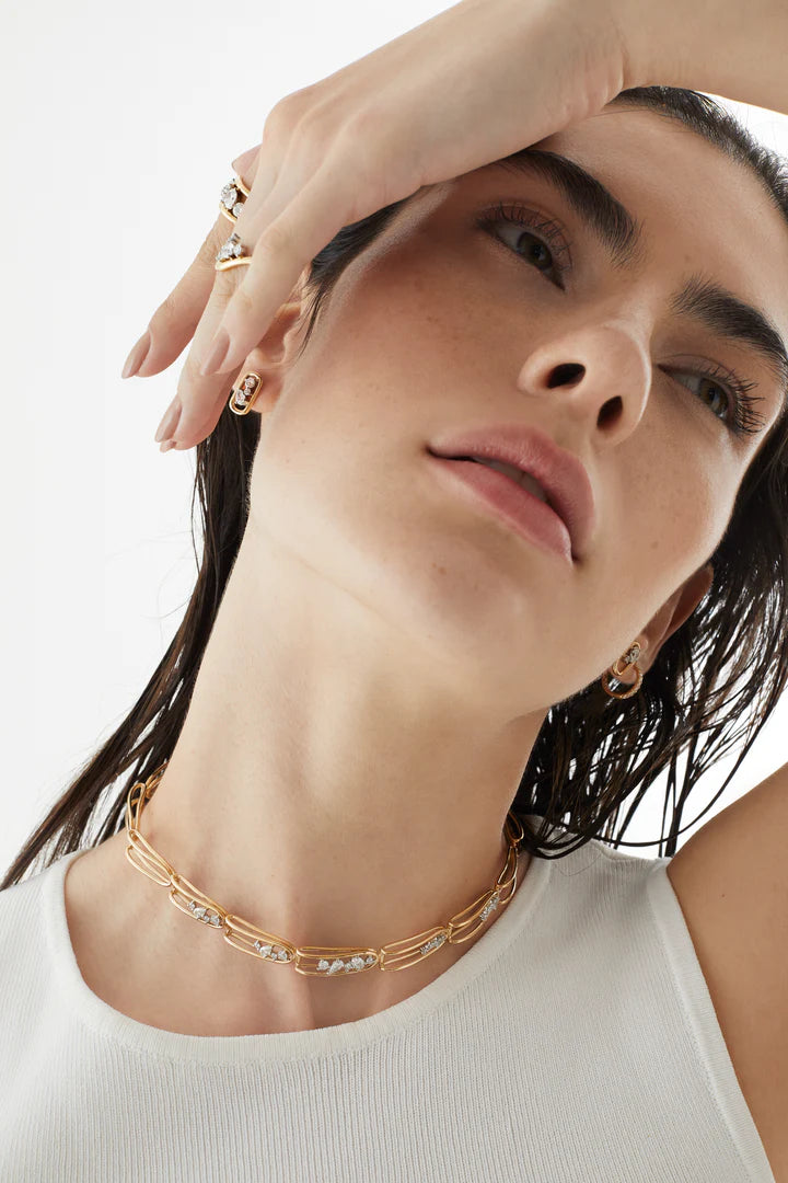 Close up of Rosario Navia Mara Folded Link Choker III in yellow gold on models neck 
