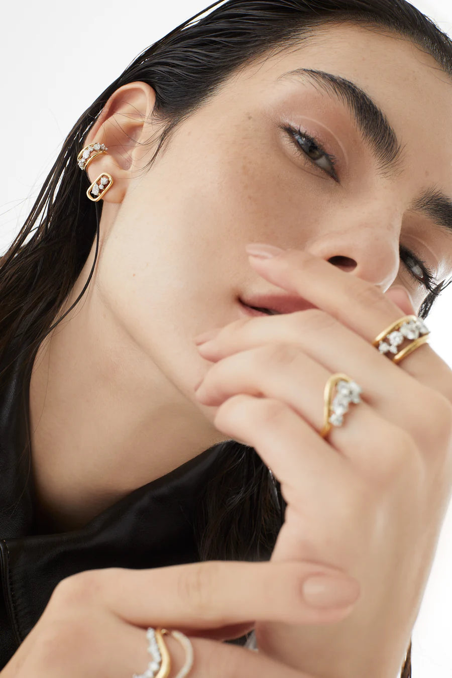 Rosario Navia Mara Stud Earrings in yellow gold styled on models ear.