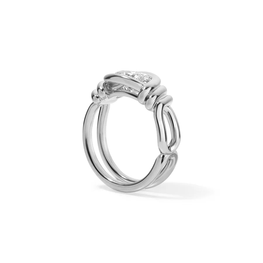 Rosario Navia Twist Link Round Diamond Ring in white gold on white background on the side