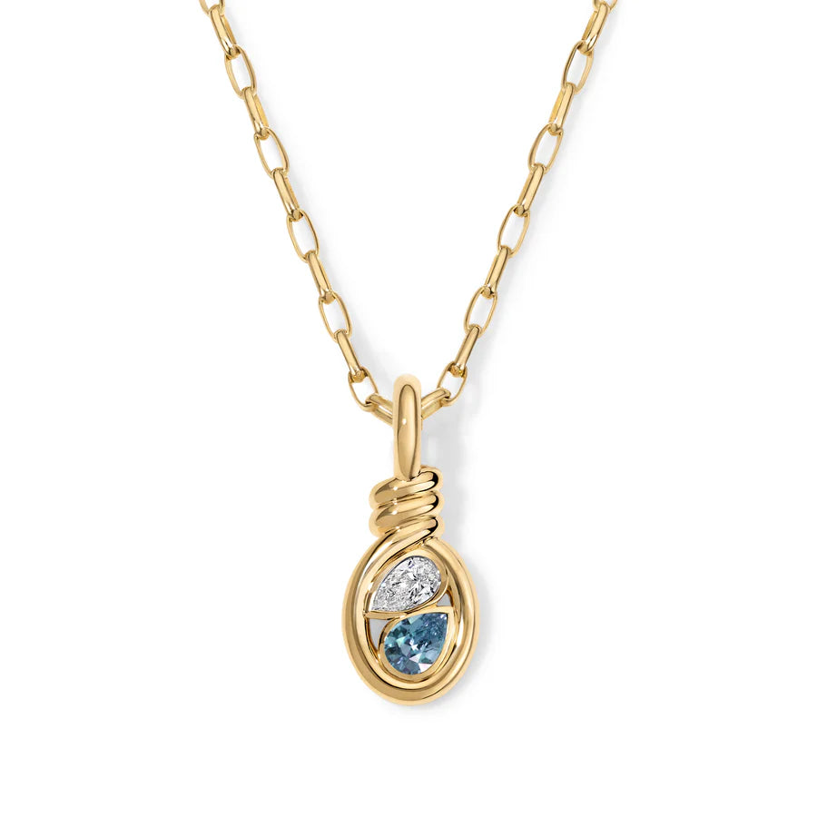 Rosario Navia Twist Two-Stone Pendant Diamond & Blue Topaz in yellow gold on white background. 