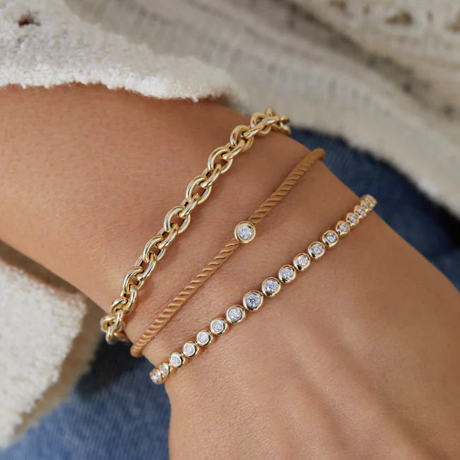 EF-Collection Sienna Chain Bracelet in yellow gold styled on models wrist wearing jeans