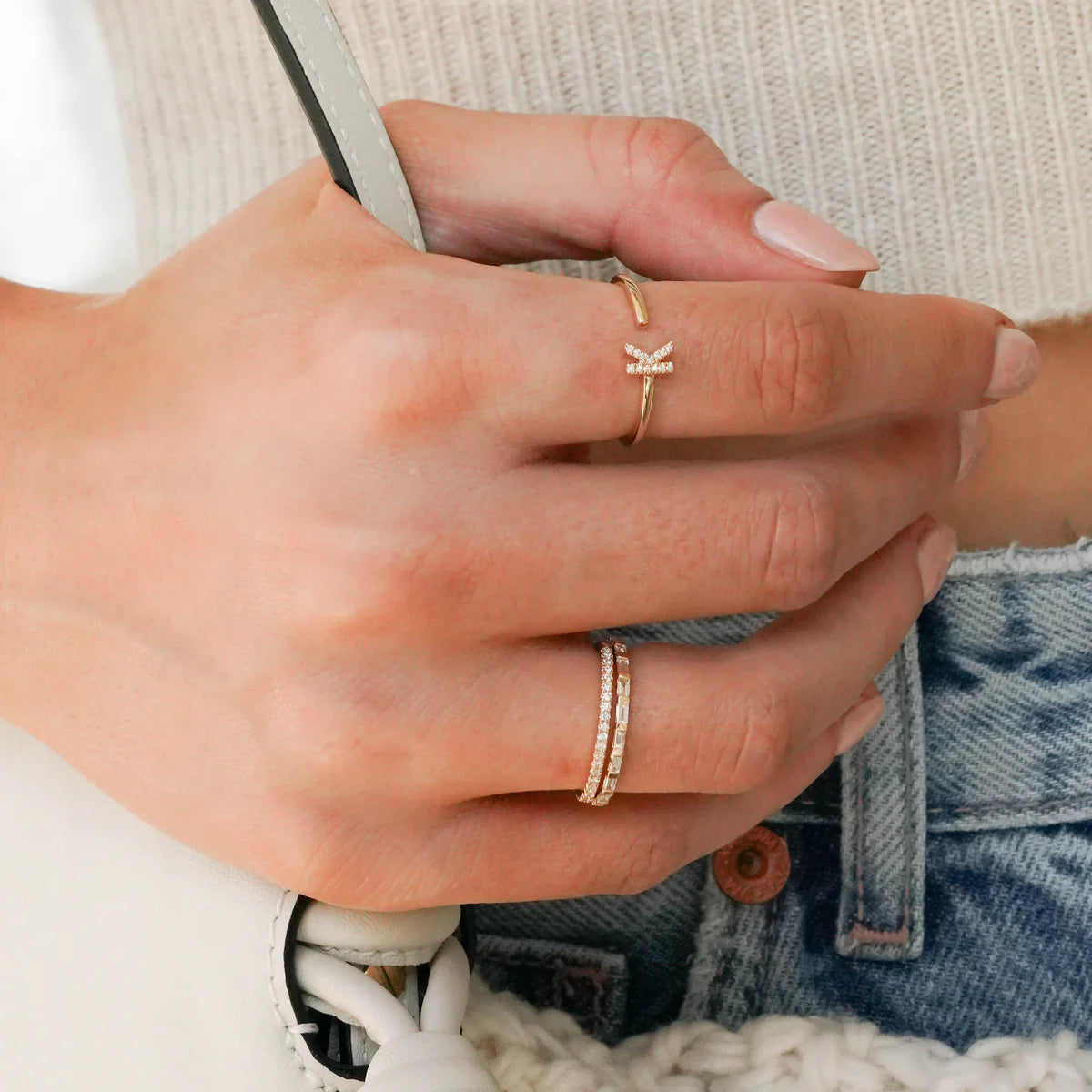 Close up of Dana Rebecca Designs Sylvie Rose Eternity Slim Ring in yellow gold on a white background. 