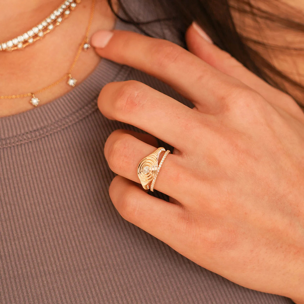 Close up of Dana Rebecca Designs Sylvie Rose Eternity Slim Ring in yellow gold on a white background. 