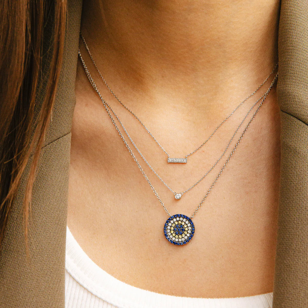 Close up of Dana Rebecca Designs Sylvie Rose Bar necklace white Gold layered with other necklaces