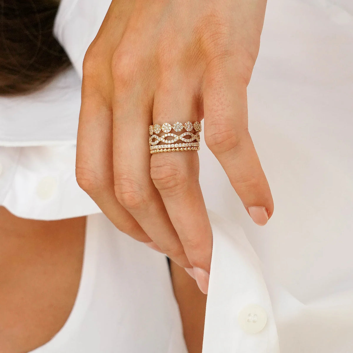 Dana Rebecca Designs Taylor Beth Eternity Band Ring in yellow gold styled on models finger wearing a white shirt 
