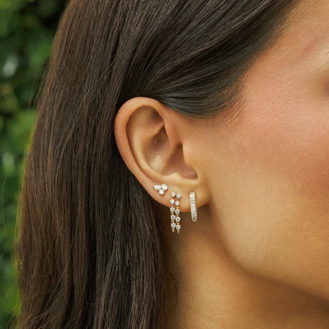 EF-Collection Triple Diamond Cluster Stud Earrings in yellow gold on models ear stacked with two different earrings.