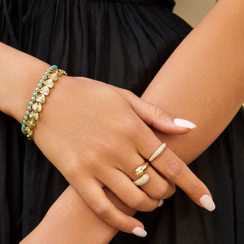 EF Collection Turquoise & Diamond Pillow Eternity Bracelet in yellow gold styled on models wrist. 