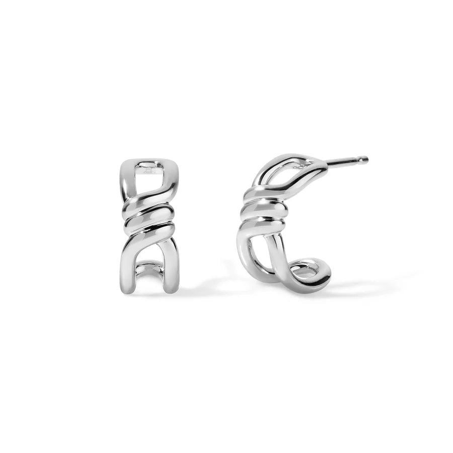 Rosario Navia Twist Link Hoops in white gold on white background 